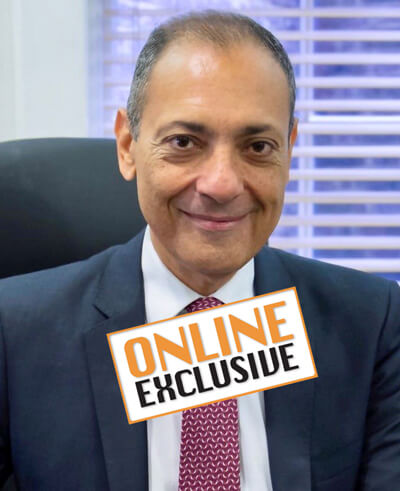 Photo of Hesham Saleh with online exclusive stamp.