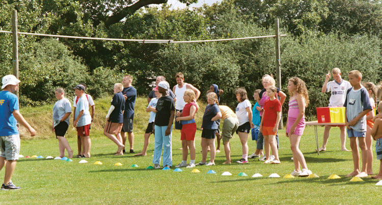 Photo showing children lining up for activities at one of the annual summer camps run by the Children’s Burns Club. 