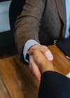 Image of people shaking hands.