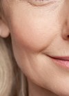 Close up image of woman's face.